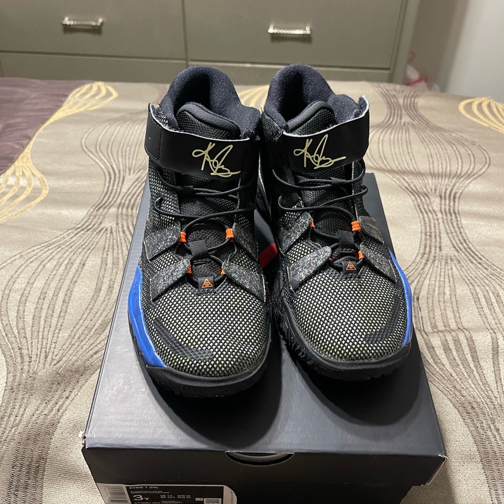 Nike Kids Black and Blue Sneakers with Orange Accents
